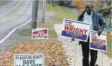  ?? CLIFFORD SKARSTEDT/EXAMINER FILE PHOTO ?? New Northcrest Ward councillor Stephen Wright picks up his municipal election signs along Carnegie Ave. on Oct. 23.