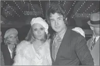  ?? AP PHOTO/MICHEL LIPCHITZ, FILE ?? In this Jan. 24, 1968, file photo, Fay Dunaway, left, and Warren Beatty appear at the Paris premiere of their film, "Bonnie and Clyde." The film premiered in the U.S. in September 1967. The film, starring Beatty and Faye as the fatalistic outlaws,...