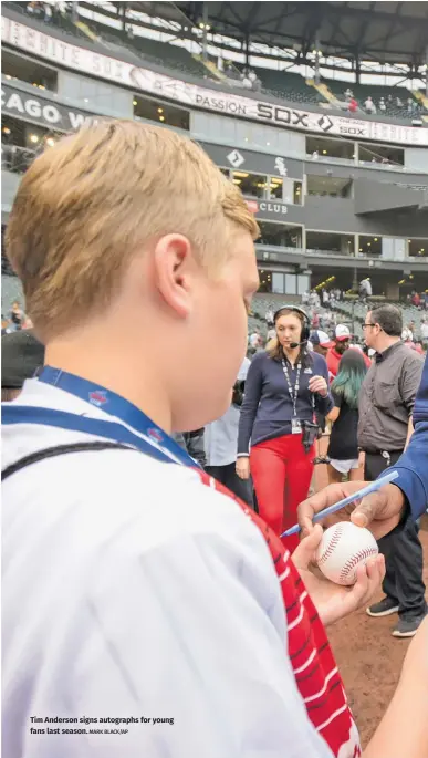  ?? MARK BLACK/AP ?? Tim Anderson signs autographs for young fans last season.