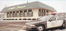  ?? | AP ?? A police car is parked outside the Palatine Brown’s Chicken& Pasta on Jan. 8, 1993, a day after seven people were murdered at the restaurant.