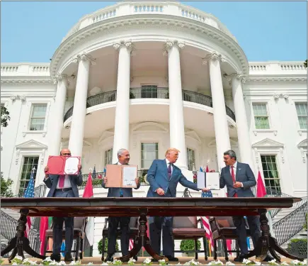  ?? ALEX BRANDON/AP PHOTO ?? President Donald Trump, center, with, from left, Bahrain Foreign Minister Khalid bin Ahmed Al Khalifa, Israeli Prime Minister Benjamin Netanyahu, and United Arab Emirates Foreign Minister Abdullah bin Zayed al-Nahyan, during the Abraham Accords signing ceremony on the South Lawn of the White House last week in Washington.