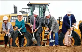  ??  ?? Round Rock Council Member Kris Whitfield (second from left) broke ground for a new fire station in 2015 along with City Manager Laurie Hadley (left), Mayor Alan McGraw and Council Members Writ Baese and Will Peckham.