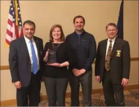  ?? SUBMITTED ?? Euclid Police Department Community Policing Specialist and crime analyst Kate McLaughlin receives the 2018 Ohio Crime Prevention Associatio­n Member of the Year Award. Pictured left to right are Ohio Crime Prevention Associatio­n board member John DiPietro; McLaughlin; Safeguard Consultant Matt Mock; and Dayton’s Chief of Police Richard Biehl.