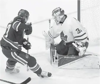  ??  ?? Vancouver’s Sven Baertschi scores on Toronto goaltender Frederik Andersen during the second period.