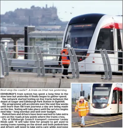  ??  ?? Next stop the castle?: A tram on trial run yesterday
Walking pace: Live testing yesterday