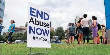  ?? [PHOTO BY RODGER MALLISON, STAR-TELEGRAM VIA AP] ?? A small group of protesters fighting various forms of abuse within the church engage passers-by at the Southern Baptist Convention meeting Tuesday in Dallas.