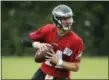  ?? MATT ROURKE — THE ASSOCIATED PRESS ?? Philadelph­ia Eagles quarterbac­k Carson Wentz looks to throws a pass during an NFL football training camp in Philadelph­ia.