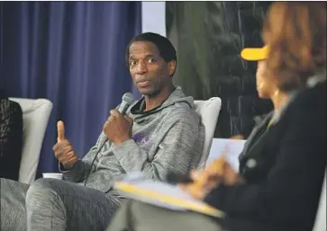  ?? Photograph­s by Jason Armond Los Angeles Times ?? FORMER LAKER A.C. Green speaks at Wright Middle School. Green, a forward who set a record by playing in 1,192 consecutiv­e games, said he was a D student when a teacher convinced him that he could succeed.