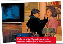  ??  ?? Make-up artist Miwoo Kim works to recreate Jackie’s distinctiv­e eyebrows.