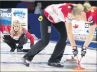  ?? CP PHOTO ?? Canada skip Jennifer Jones watches her shot being swept as they play the United States at the World Women’s Curling Championsh­ip, Friday, in North Bay, Ont.