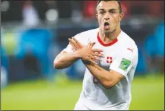  ?? The Associated Press ?? SHAQIRI, SHAQIRI: Switzerlan­d’s Xherdan Shaqiri celebrates after scoring his side’s second goal of a 2-1 win Friday in a Group E match against Serbia in the 2018 FIFA World Cup in Kaliningra­d, Russia.
