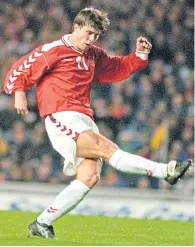  ??  ?? Brian Laudrup scores the winner for Denmark against Scotland in March, 1998