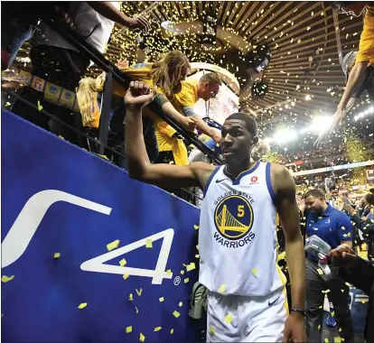  ?? DOUG DURAN — STAFF PHOTOGRAPH­ER ?? The Warriors’ Kevon Looney is playing this season for Wati Majeed, a longtime friend who died two days before the team’s season began.