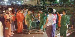  ??  ?? PATHEIN: Myanmar soldiers and members of a rescue team carry the body of a ferry passenger after the ship sank in the Nga Wun River in Pathein, a port city west of the commercial capital Yangon. — AFP