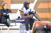  ?? KIRK IRWIN/AP ?? Ravens quarterbac­k Lamar Jackson is carted off of the field after being injured during a Dec. 12 game against the Cleveland Browns in Cleveland.