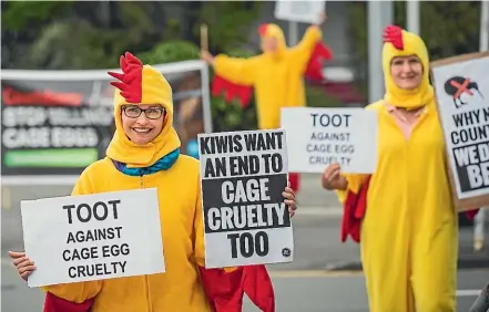  ?? BRADEN FASTIER/STUFF ?? Campaigner­s protest against the selling of caged eggs. Animal cruelty is the number one ethical concern of KiwiSaver investors.