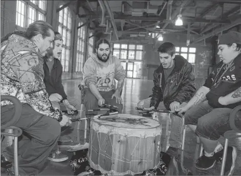  ?? MITCH MACDONALD/THE GUARDIAN ?? Members of the drum group Hey Cuzzins, from left, Gilbert Sark, Joshua Joseph, Trenton Smith, Ryan Campbell and Parker Larkin, perform during Tuesday’s announceme­nt of a new framework agreement between the province, federal government and P.E.I.’s Mi’kmaq community.