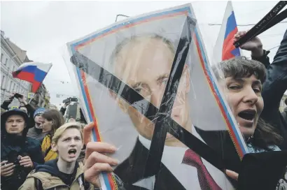  ?? Picture: AFP ?? NOT OUR MAN. Opposition supporters attend an unauthoris­ed anti-Putin rally called by opposition leader Alexei Navalny on Saturday in Saint Petersburg, two days ahead of Putin’s inaugurati­on.