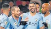  ?? REUTERS ?? Manchester City players celebrate after scoring their first goal against Watford on Tuesday.