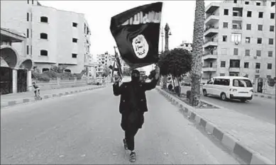  ??  ?? An Isis fighter pictured in Raqqa, where Aristidou admitted to having been based.(Photo: Reuters.com)