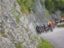  ?? Peter Dejong / Associated Press ?? The pack climbs during the 116-mile eighth stage of the Tour de France, going from Dole, France, to Station des Rousses.