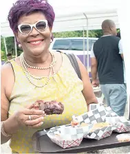  ??  ?? Janis Dixon enjoying the jerked pork.