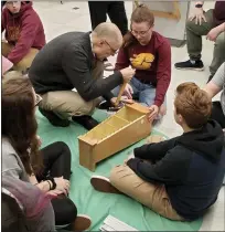  ??  ?? Members of the CMU student chapter of the National Associatio­n for Music Education (NAFME) participat­ing in an instrument repair training session.