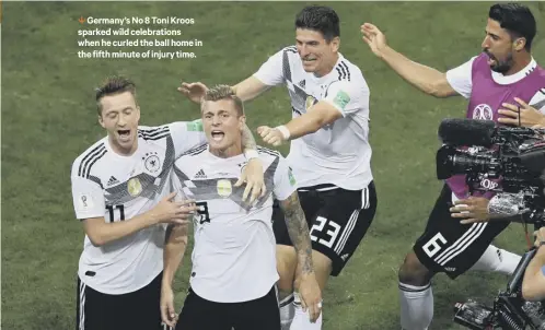  ??  ?? 1 Germany’s No 8 Toni Kroos sparked wild celebratio­ns when he curled the ball home in the fifth minute of injury time.