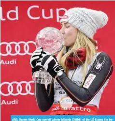 ??  ?? ARE: Slalom World Cup overall winner Mikaela Shiffrin of the US kisses the trophy as she celebrates on the podium after the Women’s Slalom event of the Alpine Skiing World Cup in Are, Sweden, yesterday. — AFP