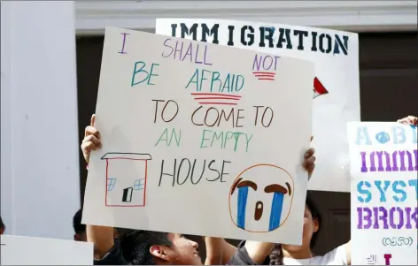  ?? ROGELIO V. SOLIS — THE ASSOCIATED PRESS ?? Children of mainly Latino immigrant parents hold signs in support of them and those individual­s picked up during an immigratio­n raid at a food processing plant in Canton, Miss., following a Spanish Mass at Sacred Heart Catholic Church in Canton, Miss., Sunday.