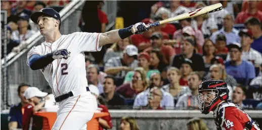  ?? Rob Carr / Getty Images ?? With an eye on pulling low line drives, Alex Bregman hit 15 long balls in the first round of Monday’s Home Run Derby, losing by one to Kyle Schwarber.