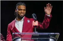  ?? MIKE STEWART — THE ASSOCIATED PRESS ?? The Bills' Damar Hamlin waves after being introduced as the winner of the NFLPA's Alan Page Community Award on Wednesday.