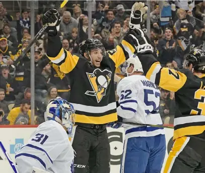  ?? Peter Diana/Post-Gazette ?? Anthony Angello celebrates after scoring in a 5-2 win against the Maple Leafs Tuesday at PPG Paints Arena. It was the 23-year-old rookie’s first NHL goal. “I can play in this league. I can be successful,” he said.