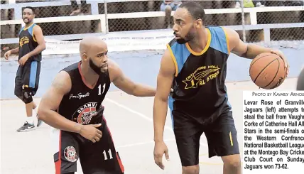  ?? PHOTO BY KAVARLY ARNOLD ?? Levar Rose of Granville Jaguars (left) attempts to steal the ball from Vaughn Corke of Catherine Hall AllStars in the semi-finals of the Western Confrence National Basketball League at the Montego Bay Cricket Club Court on Sunday. Jaguars won 73-62.