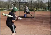  ?? MICHAEL CONROY — THE ASSOCIATED PRESS ?? Wes Anderson throws to his son Gabe at Lions Park in Zionsville, Ind. on April 7, as they practice in case baseball resumes after the season was stopped due to the coronaviru­s outbreak.