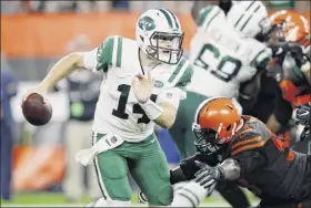  ?? Joe Robbins / Getty Images ?? Sam Darnold of the Jets was under some pressure in the fourth quarter Thursday against Cleveland and threw a pair of late intercepti­ons.