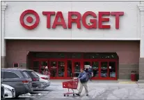  ?? CHARLES KRUPA - THE ASSOCIATED PRESS ?? A Target store on Monday in Salem, N.H. Target reported on Tuesday a 43% drop in profits and a slight uptick in sales for the holiday quarter.