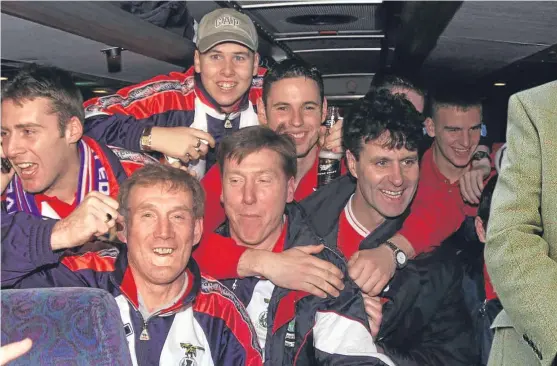  ?? Picture: SNS. ?? Inverness players celebrate their cup win over Celtic in February 2000 with manager Steve Paterson.