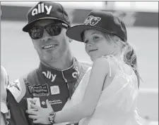  ?? TERRY RENNA/AP PHOTO ?? In this Aug. 31 file photo, Jimmie Johnson holds his daughter Lydia on pit road before qualifying for the NASCAR Cup race at Darlington Raceway in Darlington, S.C.