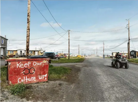  ?? Photos by Keri Oberly ?? A dumpster painted by the youth of Nuiqsut, Alaska, has a message for residents. Each dumpster around the village has a different message and painting.