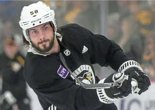  ?? Peter Diana/Post-Gazette ?? Kris Letang was a fulll participan­t in Friday’s practice in Cranberry. He has missed the past nine games with an upper-body injury.
