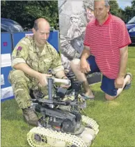  ?? FM4813267 ?? L/Cpl David Montandon shows Ron Noifeld a bomb disposal robot