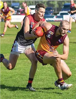  ?? ?? Drouin captain Jarrod Marshall tries to escape the tackle of Warragul’s Matthew O’Halloran.