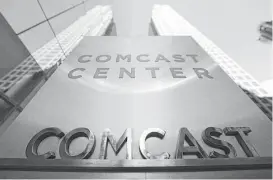  ?? Matt Rourke / Associated Press file ?? Comcast, based in Philadelph­ia, is forming a wireless alliance with Charter.