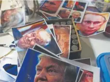  ?? Daniel Brenner, Special to The Denver Post ?? Landon Meier uses several pictures of Trump and Vladimir Putin to recreate skin tone, expression and hair for his realistic-style masks.