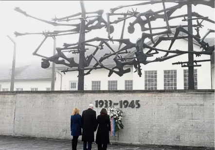  ??  ?? Eerie sight: (From left) Charolotte, Pence and Karen standing in front of the Internatio­nal Memorial at the former Nazi concentrat­ion camp of Dachau, southweste­rn Germany. — AFP