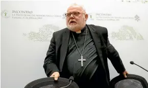  ??  ?? Cardinal Reinhard Marx leaves at the end of a media briefing during a fourday sex abuse summit called by Pope Francis, in Rome.