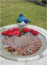  ??  ?? CLOCK WISE FROM BOTTOM LEFT:Pansies give colour throughout winter. Another example of Basil's handiwork. Camellias float in a bird bath. A simple sculpture of shells and junk shop treasure. Basil’s carefully engineered giant wind chimes took him six months to build.