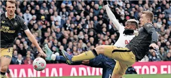  ?? | AFP ?? TOTTENHAM’s Emerson Royal scores his side’s fourth goal in their 5-1 demolition of Newcastle yesterday.
