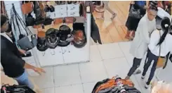  ?? ?? A SCREENGRAB from video footage shows suspects allegedly shopliftin­g in Canal Walk.